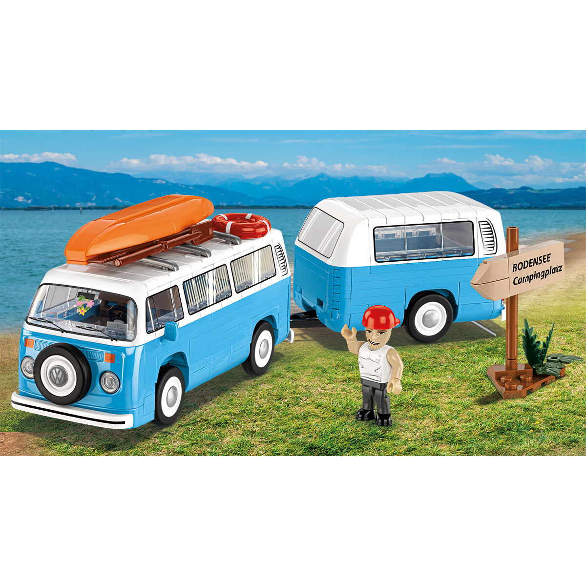 Volkswagen Camper Van z przyczepą, kajakiem i figurką turysty
